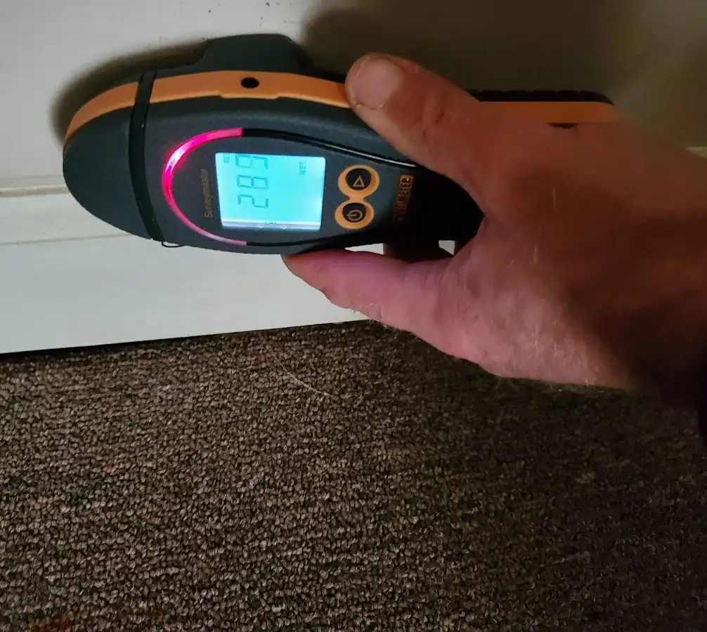 Moisture detection at baseboard during Storm Damage Restoration in Grand Prairie